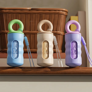 Twist-lock waste bag dispenser with leash attachment strap for dogs