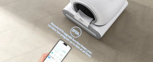 Smart pet litter box with smartphone app control on a tiled floor